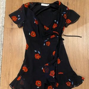 All in Favor Black and Orange Ruffled Wrap Sundress